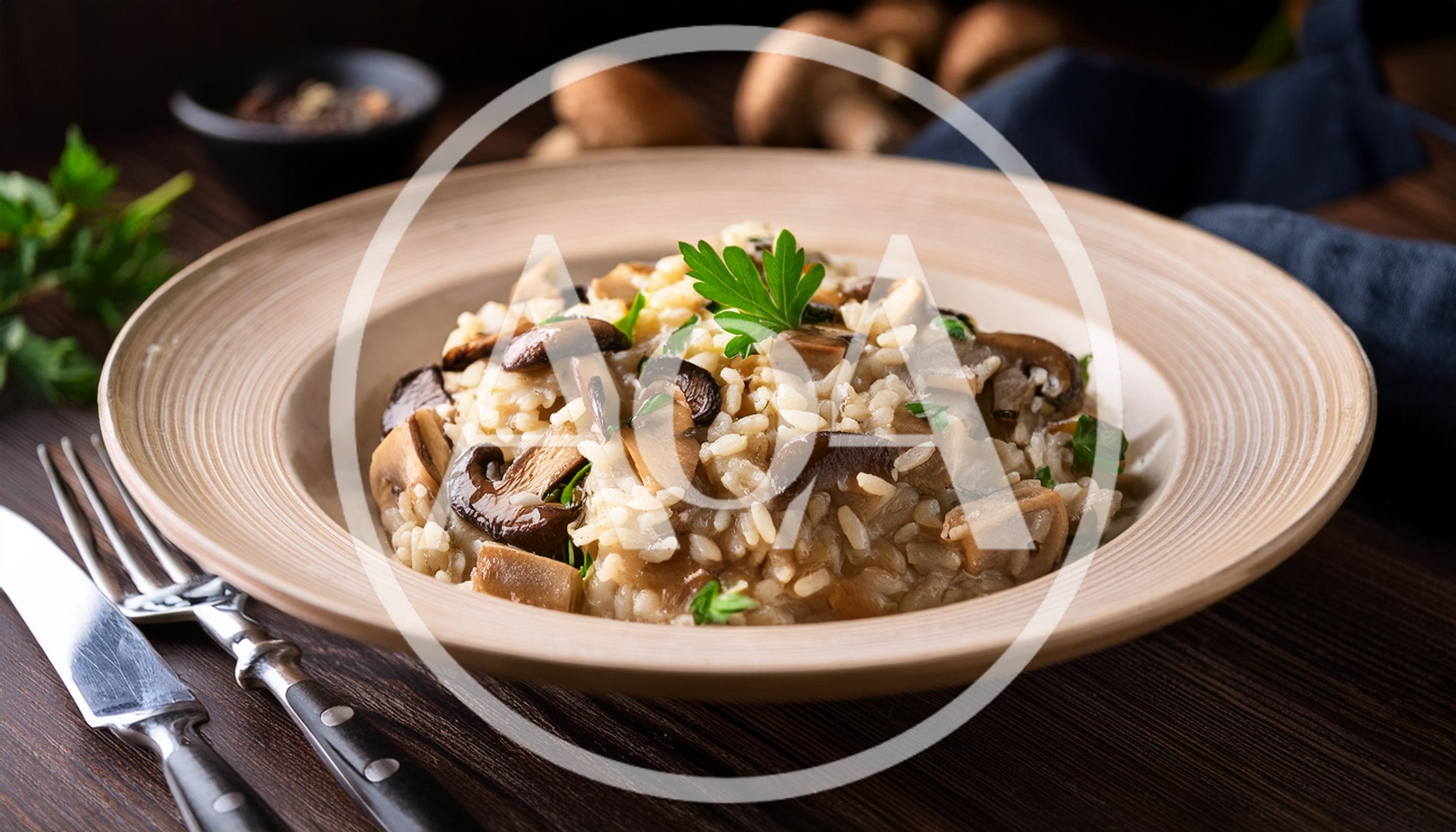 Mushroom Risotto Served In A Rustic Ceramic Bowl