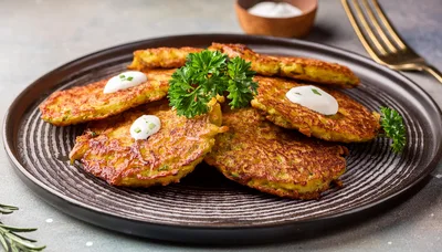 Crispy Potato Pancakes Served On A Dark Plate