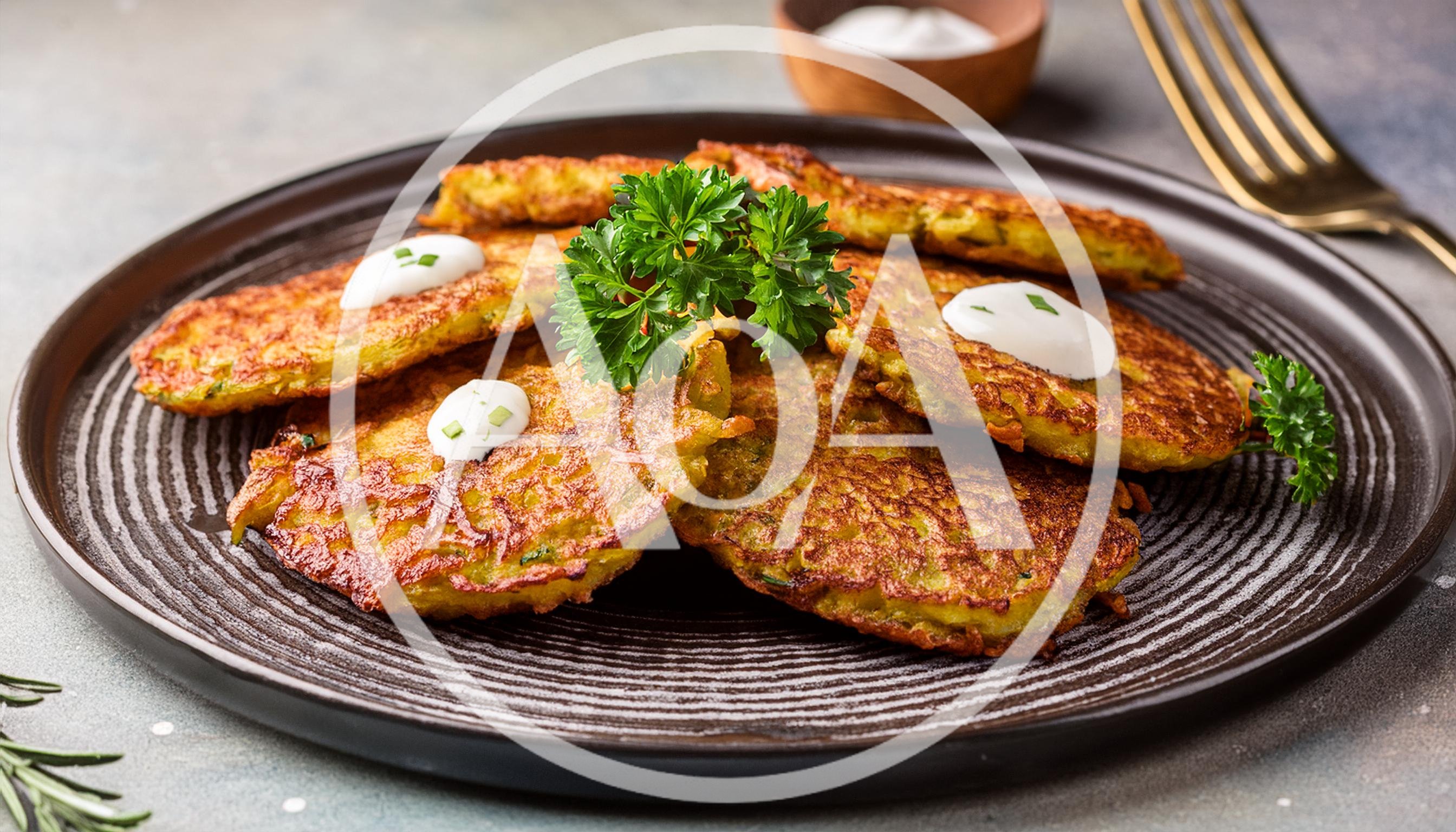 Crispy Potato Pancakes Served On A Dark Plate
