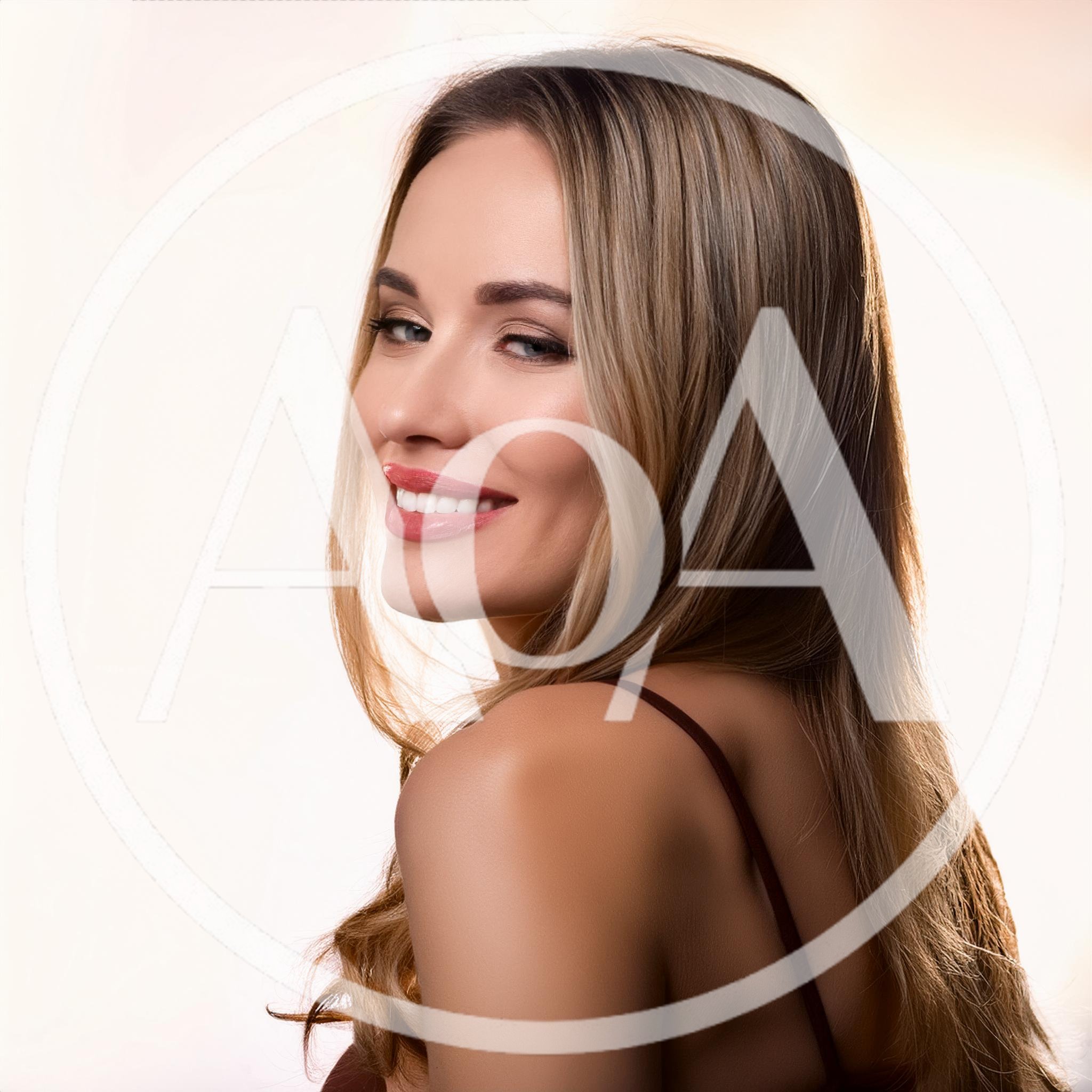 Beautiful Blonde Woman Smiling Over Her Shoulder