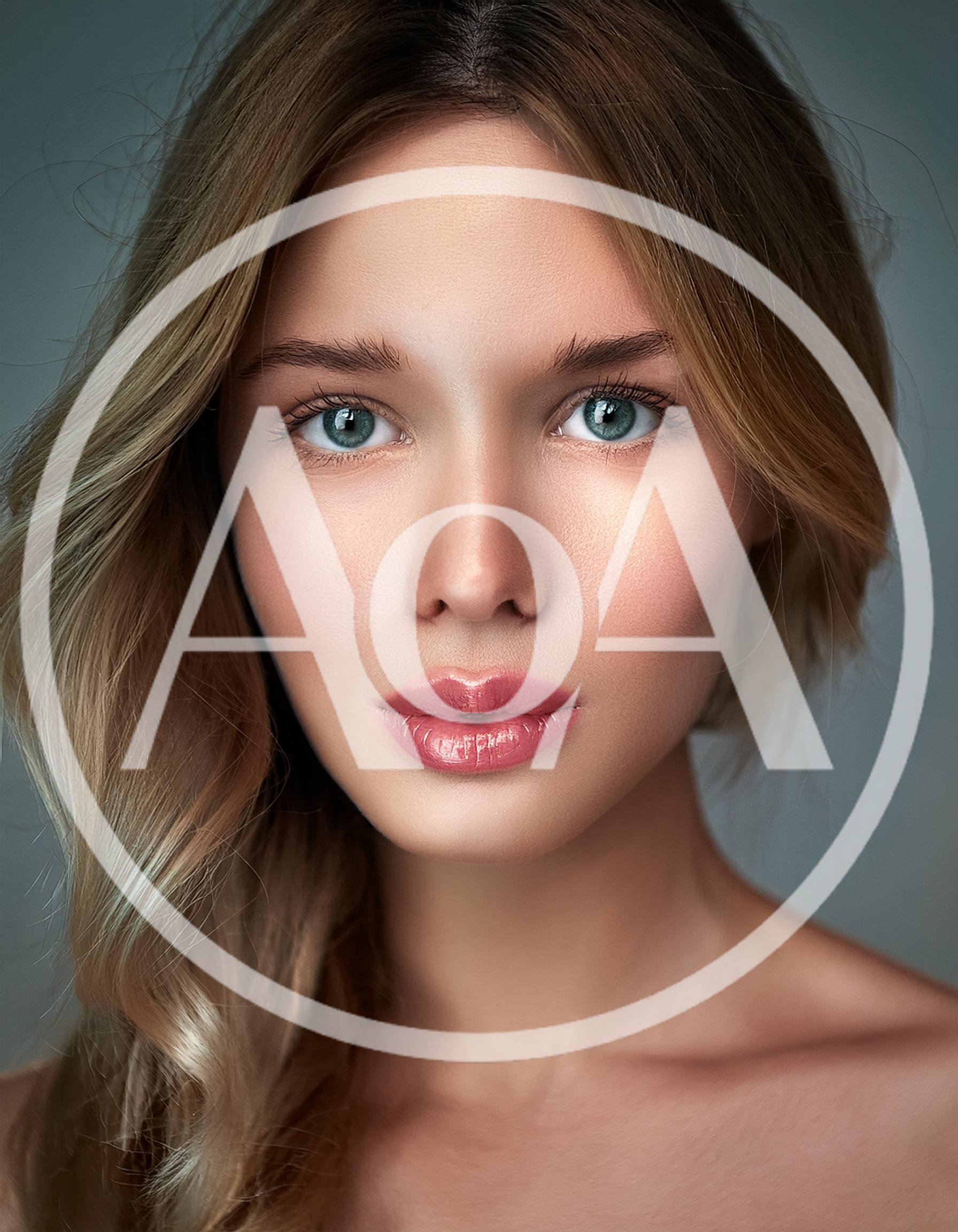 Portrait Of A Beautiful Young Woman With Blonde Hair