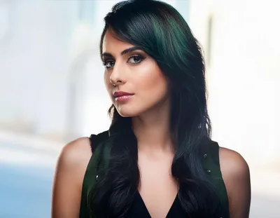 Portrait Of A Young Woman With Dark Green Hair