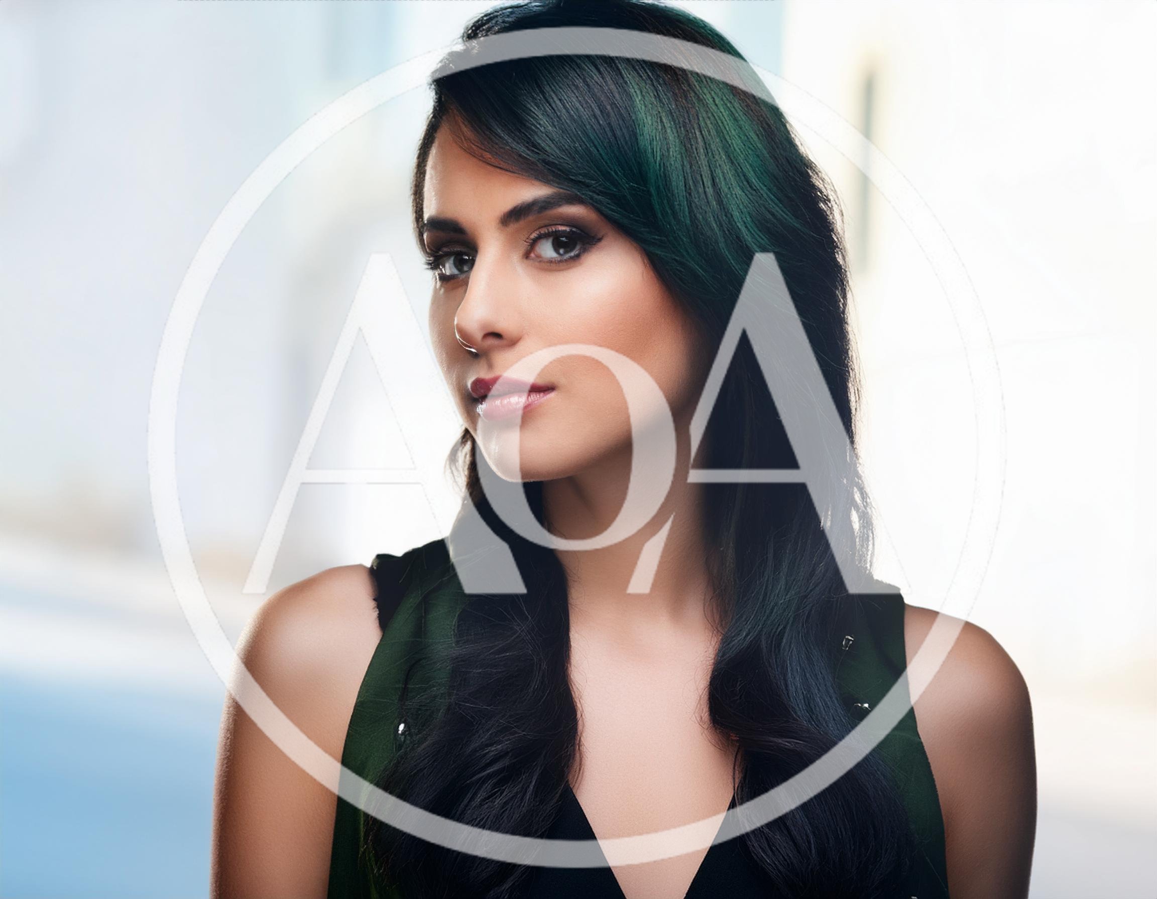 Portrait Of A Young Woman With Dark Green Hair