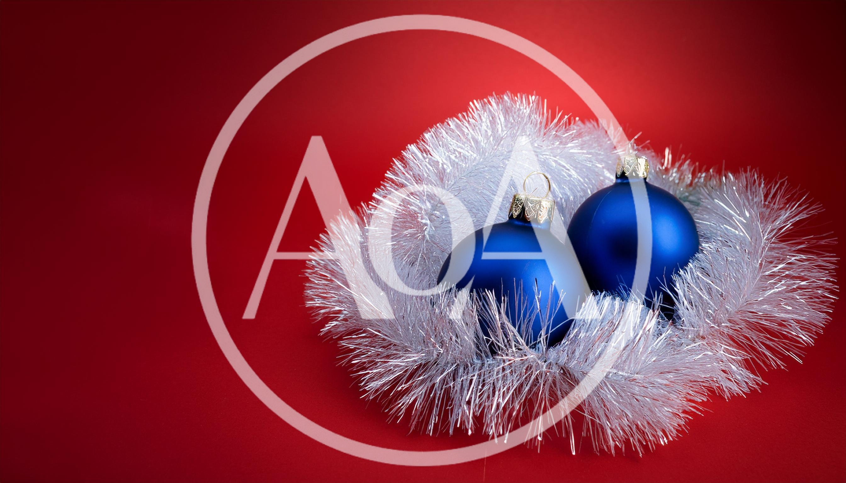 Two Blue Christmas Ornaments With Silver Tinsel