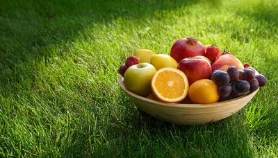Fresh Fruit Bowl Sitting On Green Grass