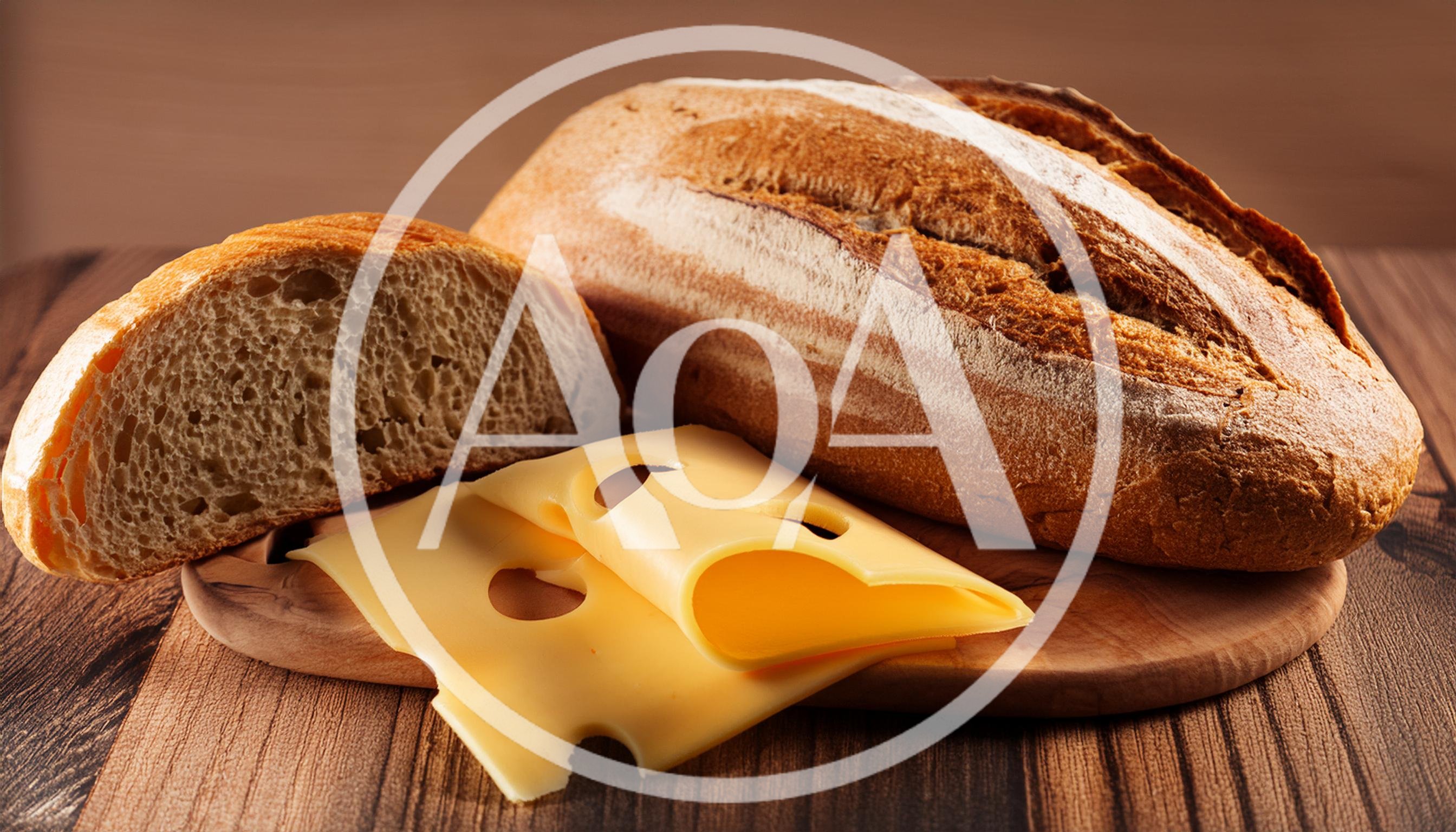 Fresh Bread Loaf And Swiss Cheese Slices On Board