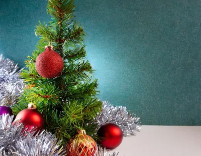 Small Christmas Tree Decorated With Red Ornaments