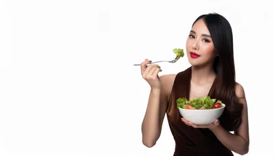 Beautiful Asian Woman Eating Fresh Salad