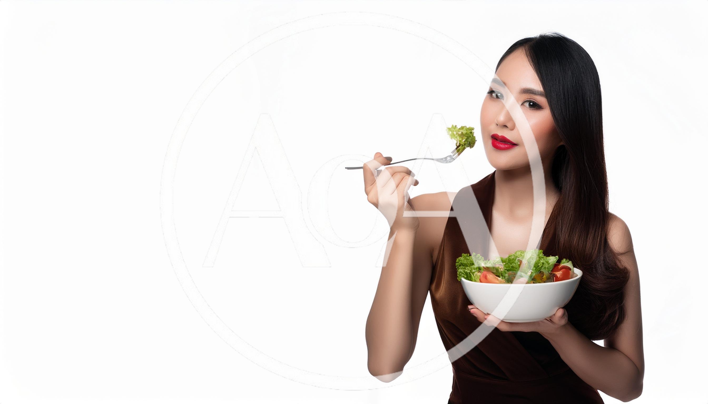 Beautiful Asian Woman Eating Fresh Salad