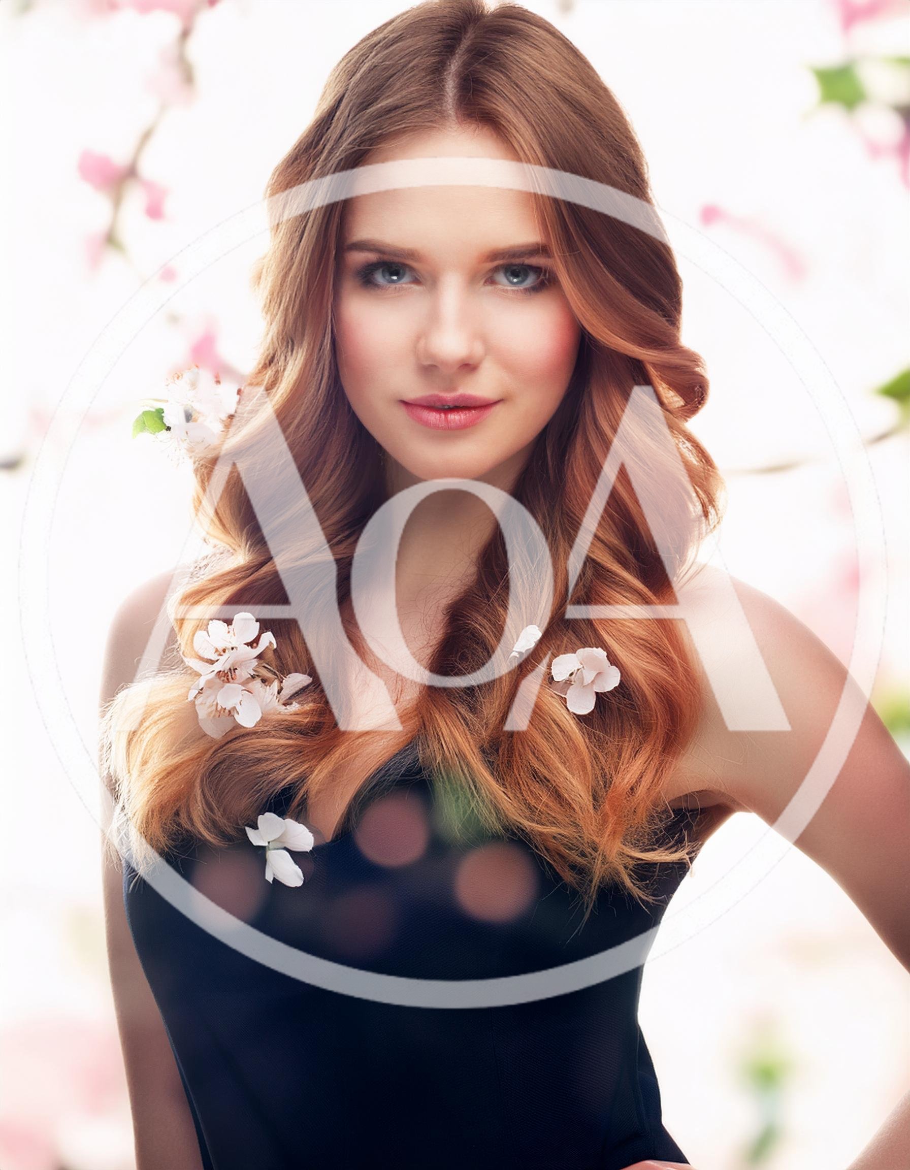Portrait Of A Beautiful Woman With Spring Flowers