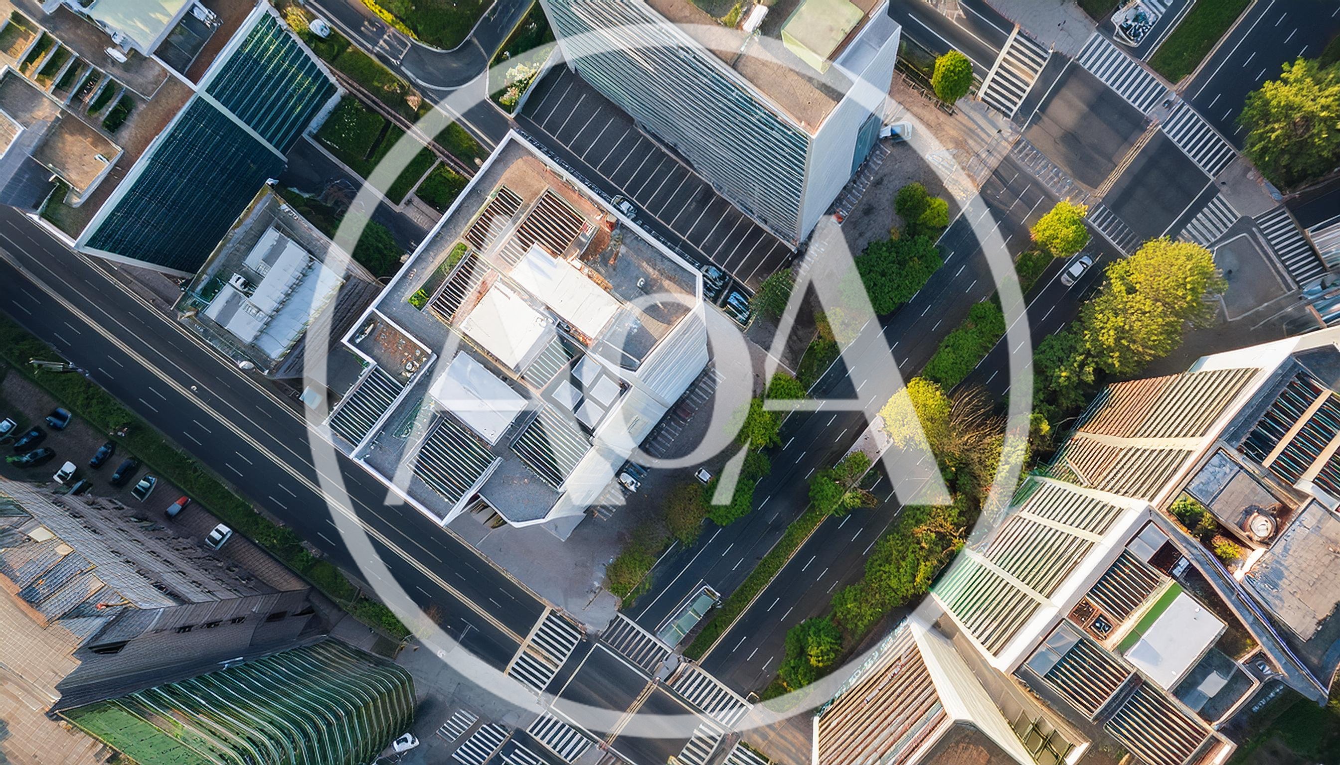 Aerial View Of Modern Urban Cityscape And Streets