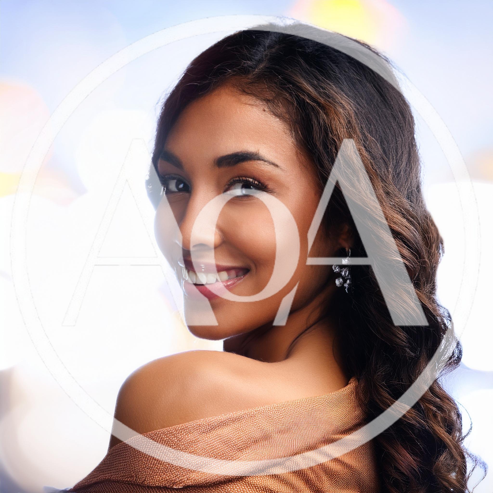 Portrait Of A Smiling Young Woman Looking Over Shoulder