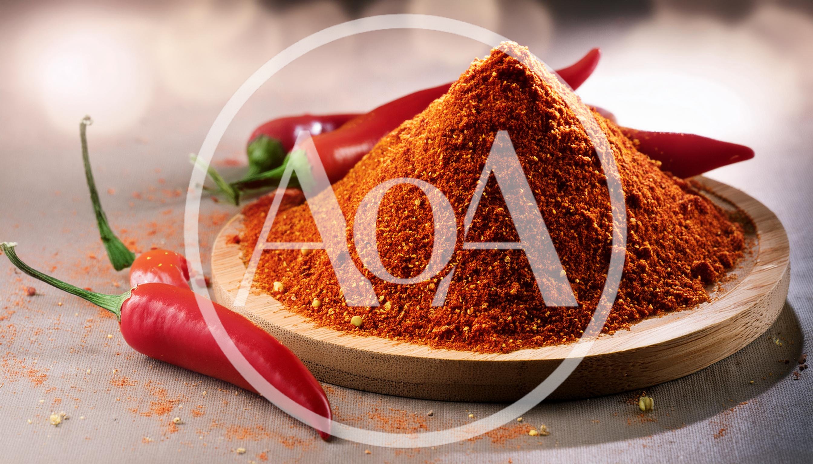 Pile Of Red Chili Powder On Wooden Plate