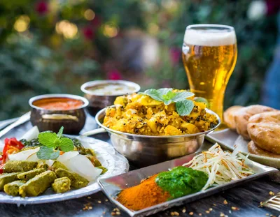 Traditional Indian Meal With Curry And Beer