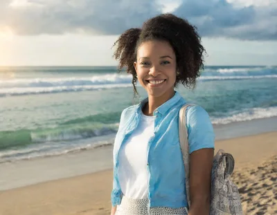 Young Woman Smiling On A Sunny Beach