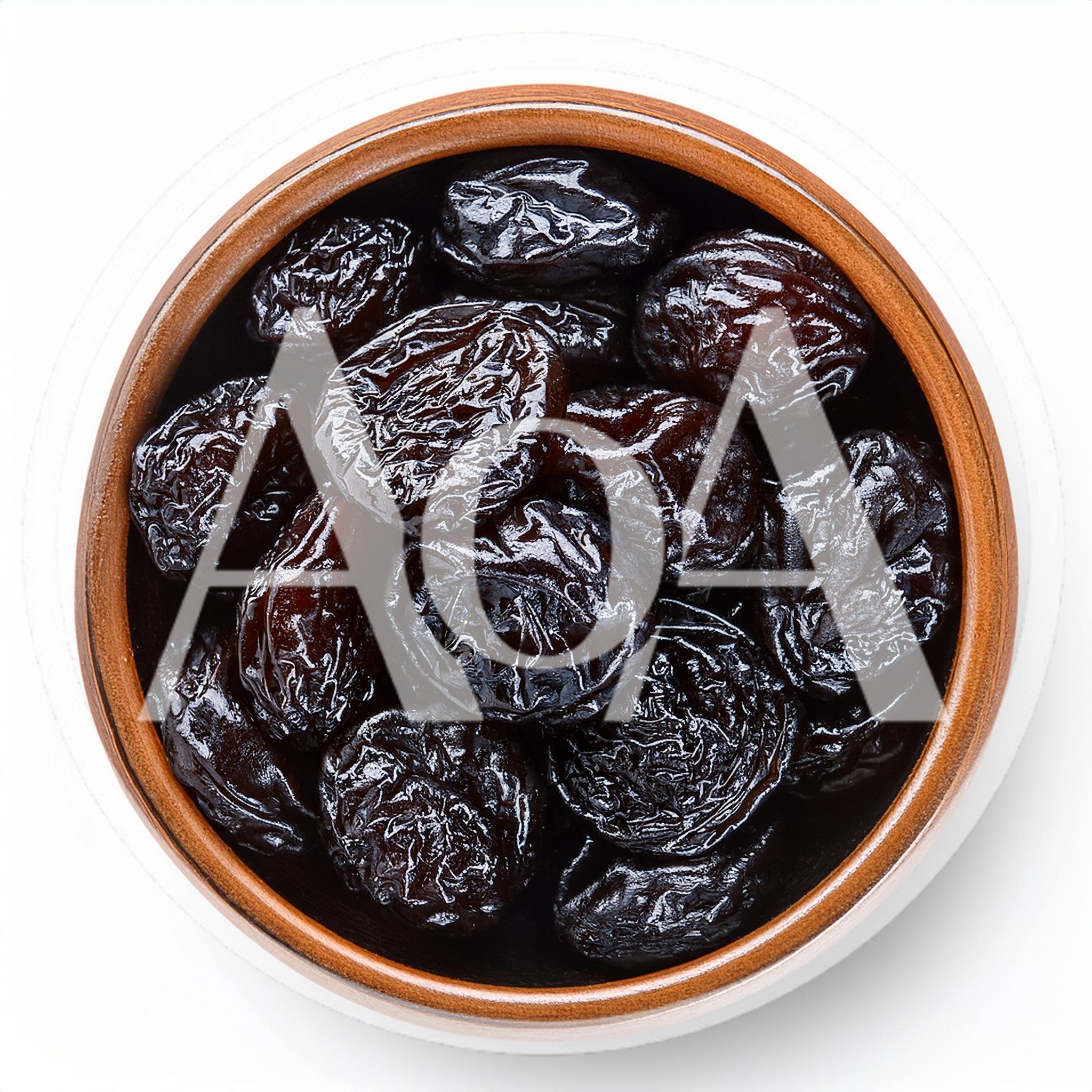Top View Of Dried Prunes In A Ceramic Bowl