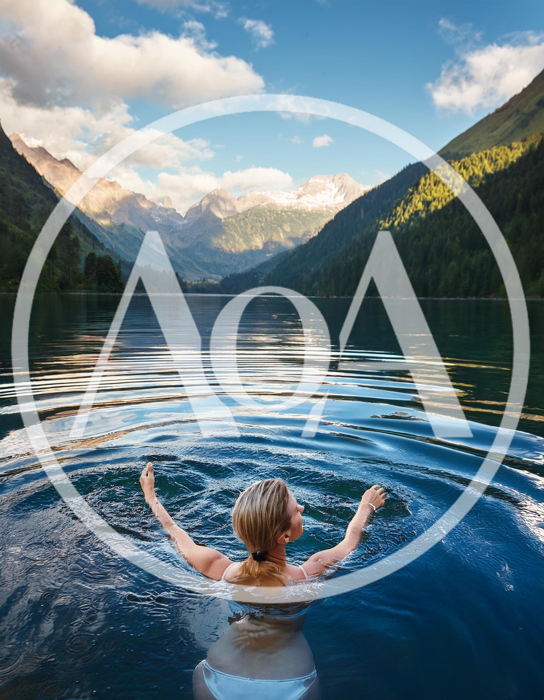 Woman Swimming In A Serene Alpine Lake