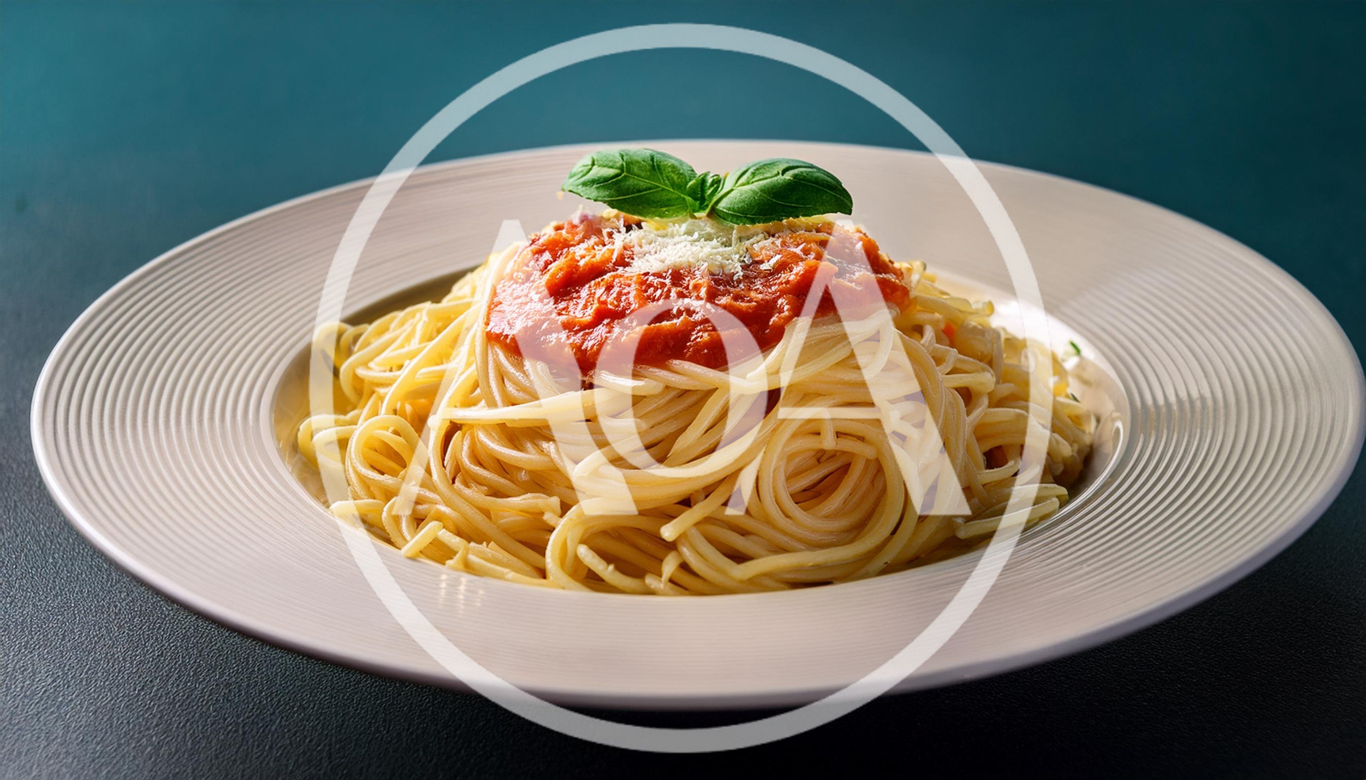 Spaghetti With Tomato Sauce And Basil On A Plate