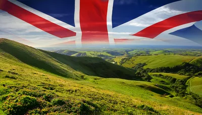 United Kingdom Flag Over Rolling Green Hills Landscape