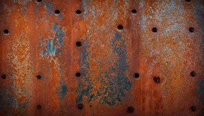 Weathered Metal Plate With Bullet Holes And Rust