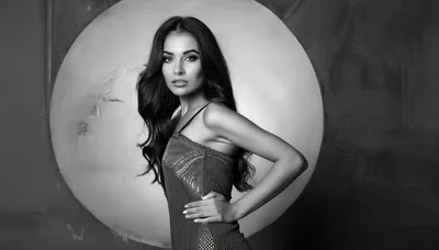 Elegant Woman Posing In A Sparkling Evening Dress