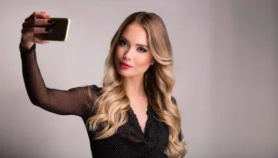 Beautiful Blonde Woman Taking A Selfie With Smartphone