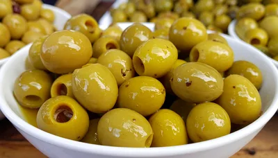 Fresh Pitted Green Olives In A White Bowl