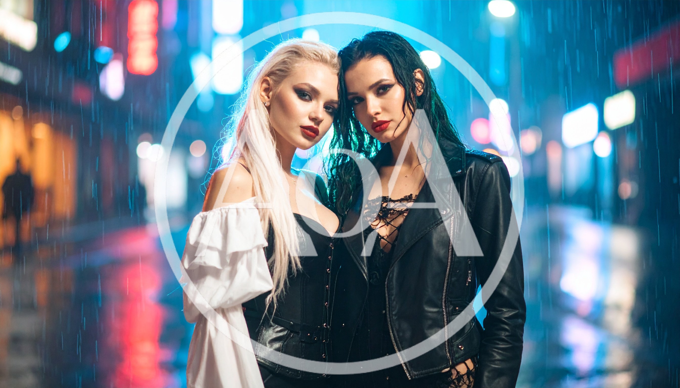 Two Stylish Women Posing In Rainy City Street