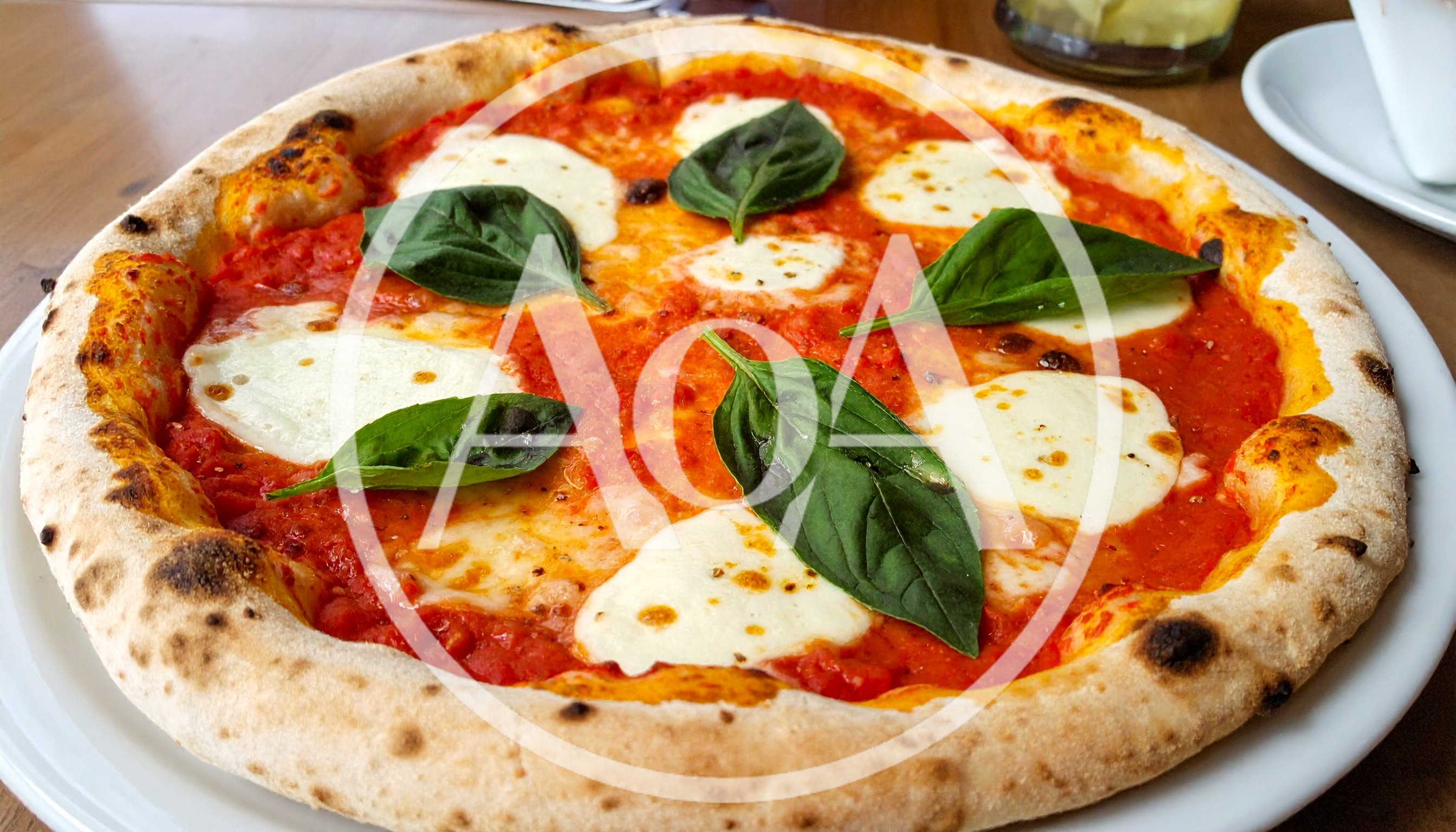 Freshly Baked Margherita Pizza On A White Plate