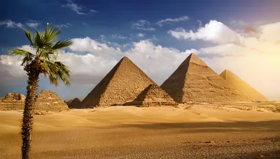 The Great Pyramids of Giza Under Sunny Desert Sky