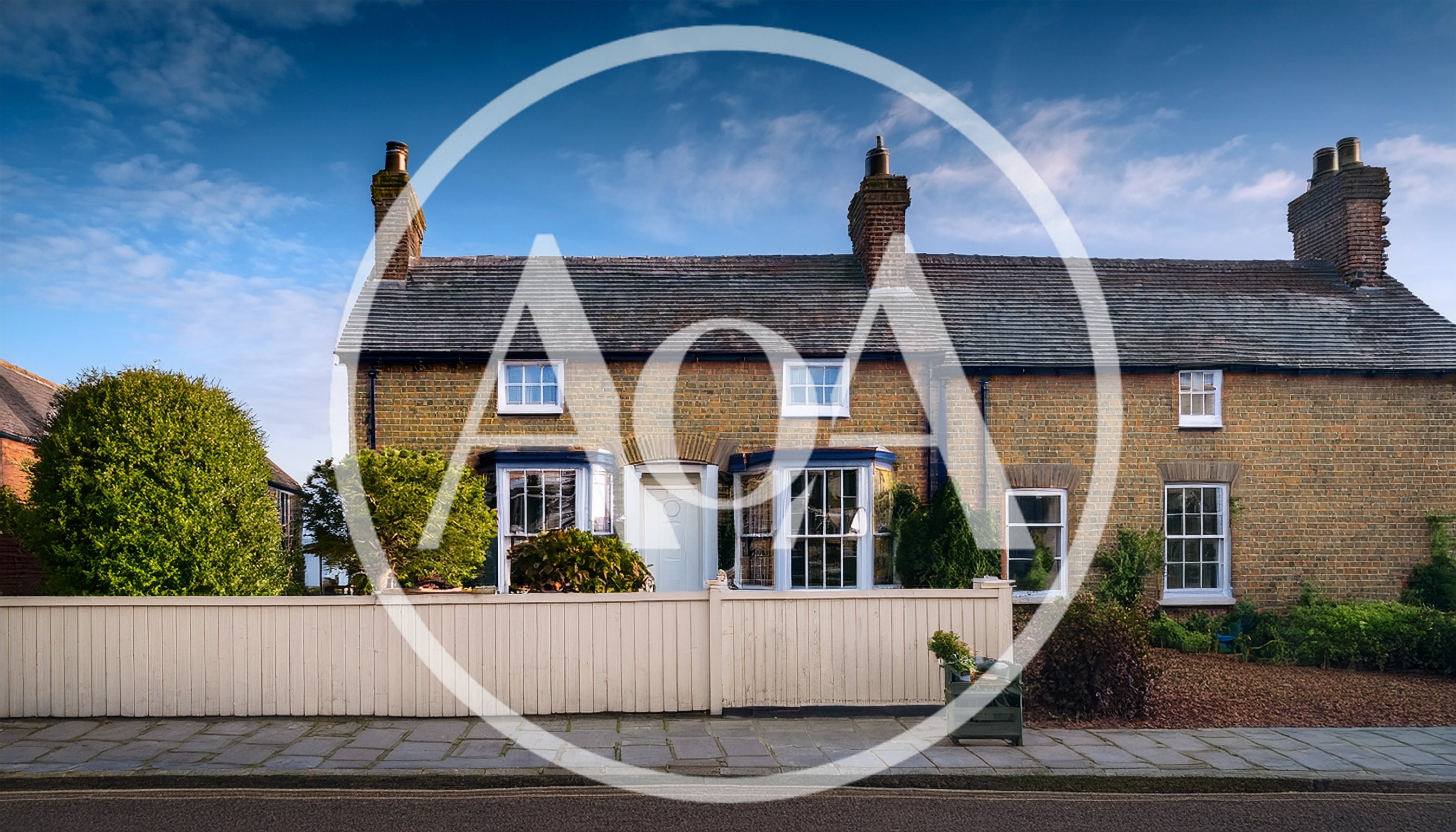 Traditional English Brick Cottage With White Picket Fence
