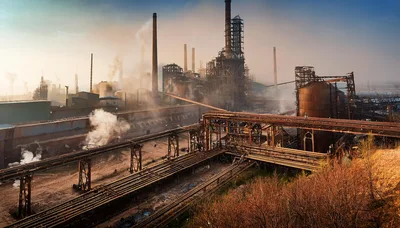 Industrial Steel Plant With Smoking Chimneys And Pipelines
