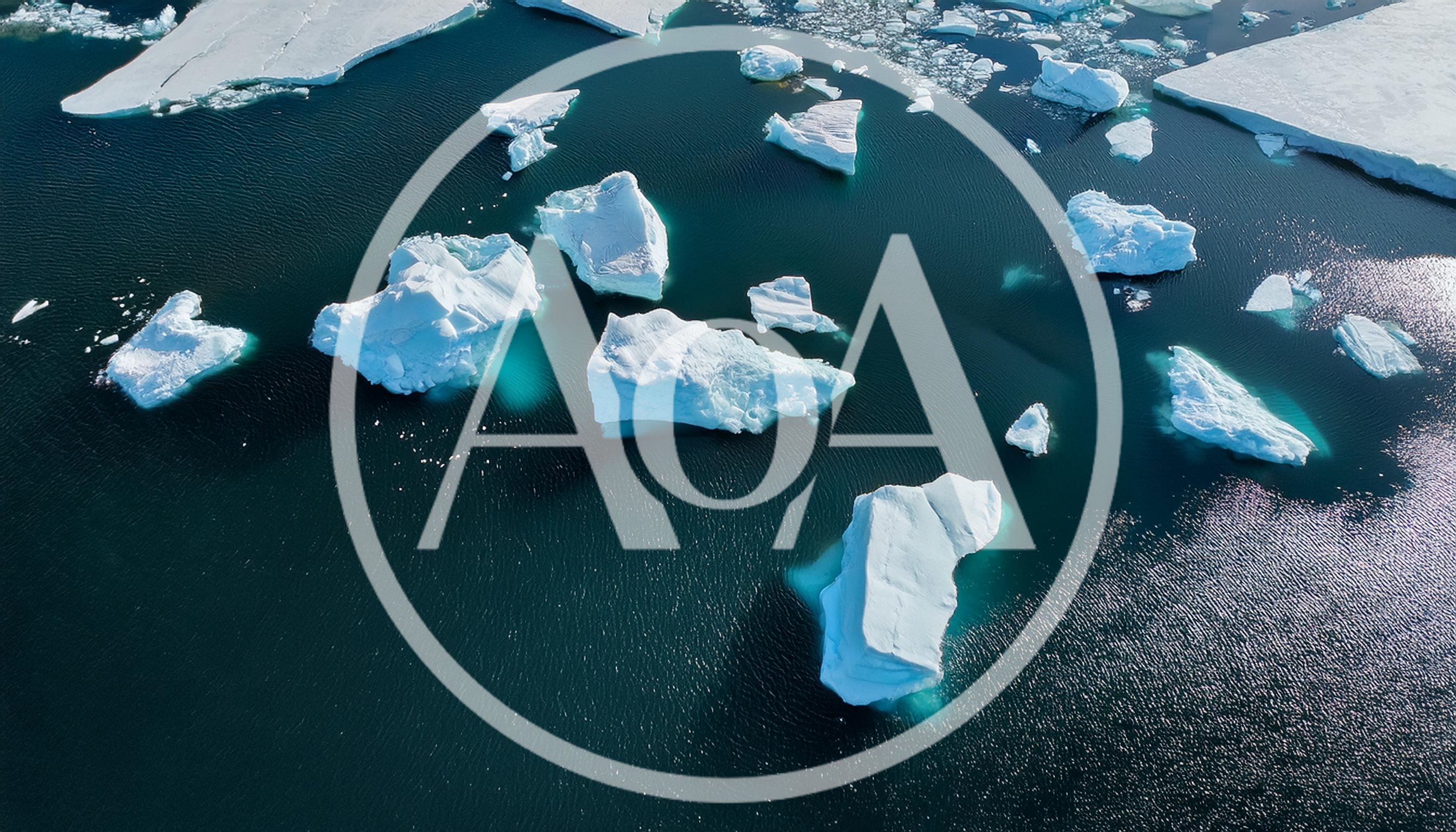 Aerial View Of Icebergs Floating In Arctic Ocean
