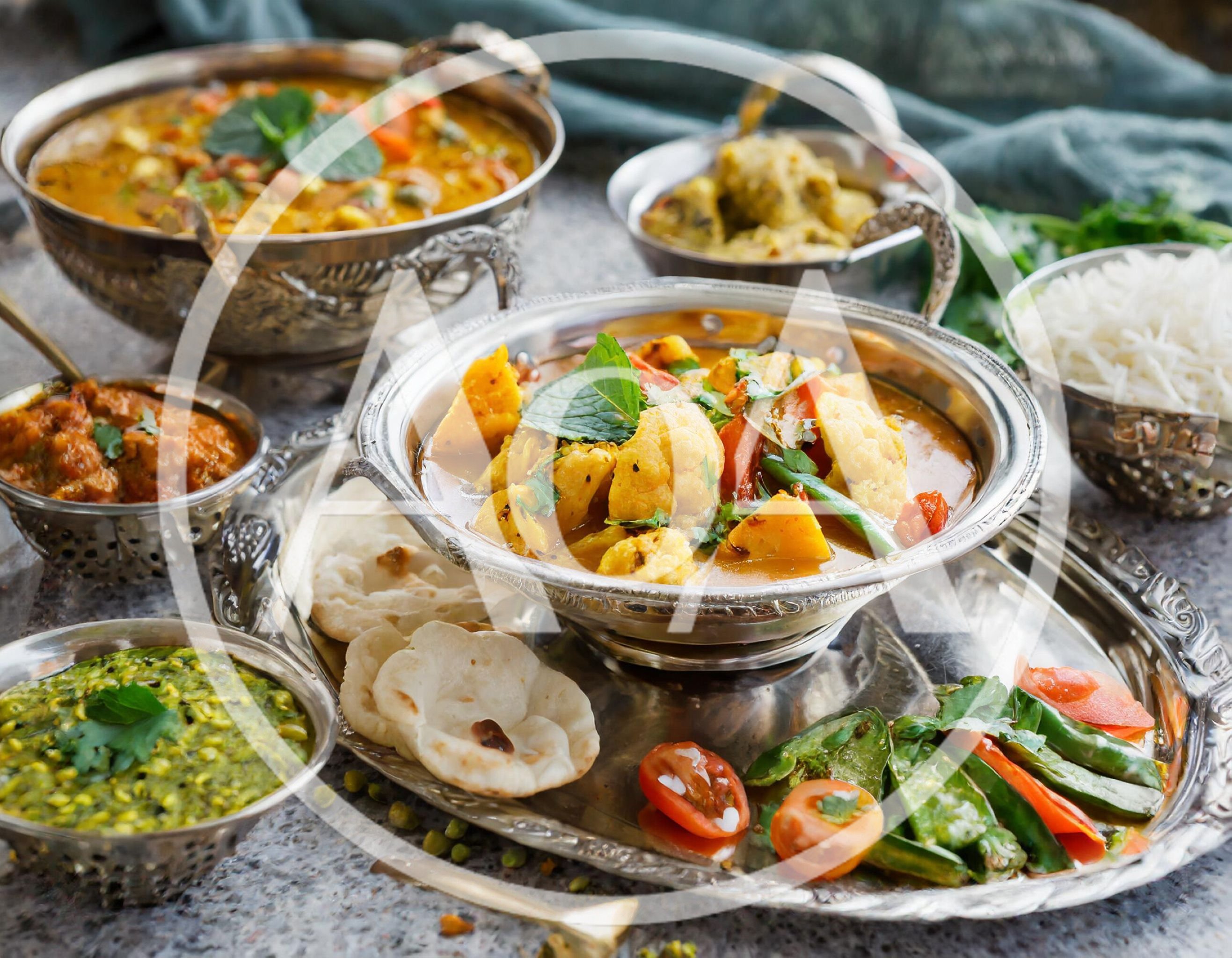 Traditional Indian Thali Platter With Assorted Curries And Bread