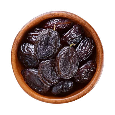 Dried Prunes in a Wooden Bowl