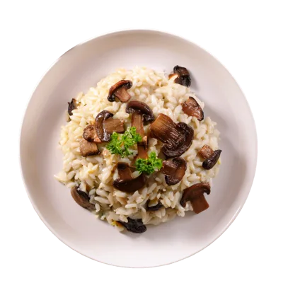 Mushroom Risotto Served On A White Plate