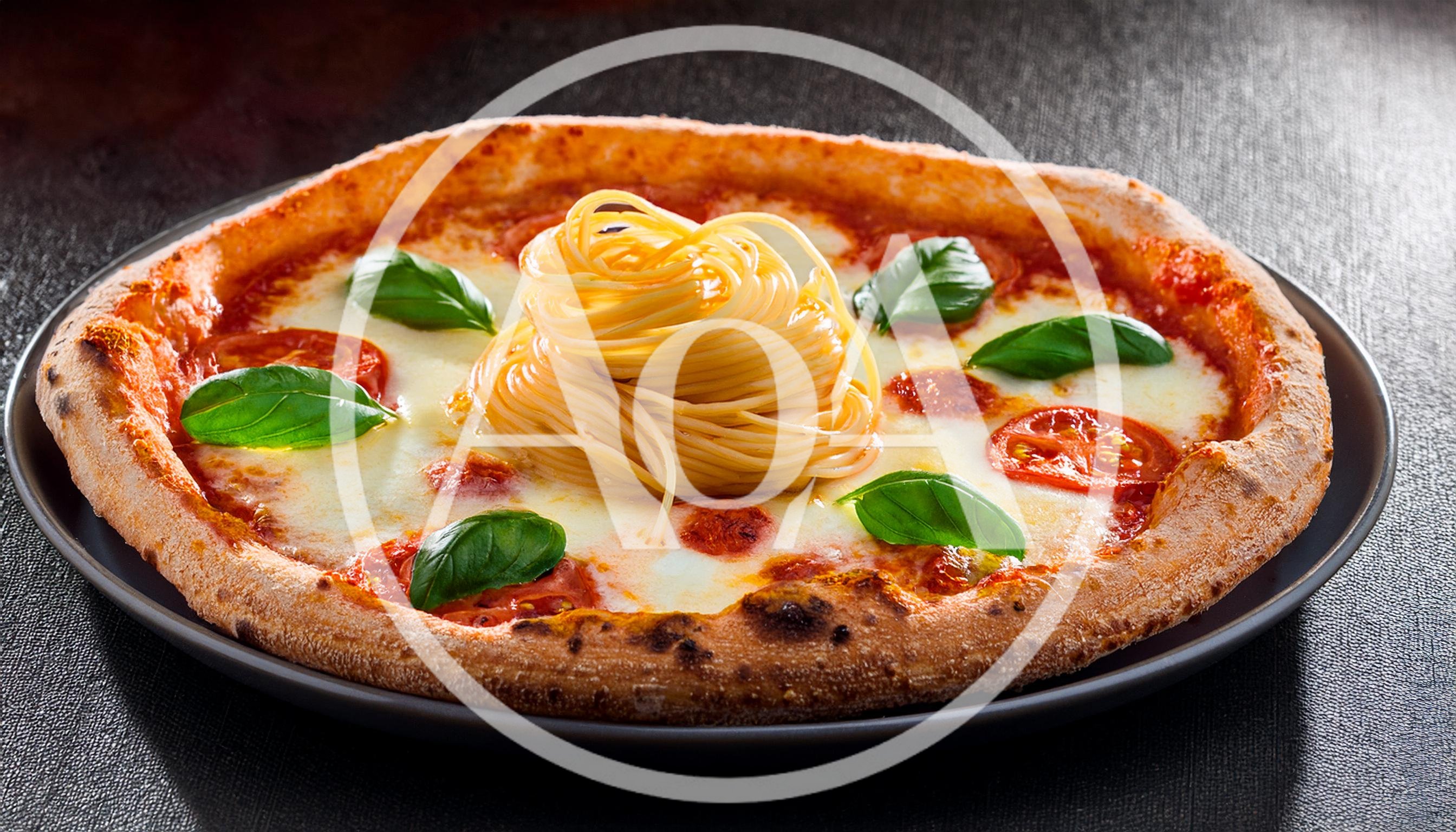 Gourmet Pizza Topped With A Nest Of Spaghetti
