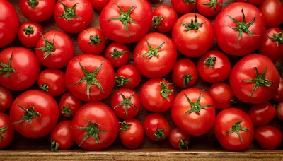 Fresh Red Tomatoes Arranged On A Wooden Surface
