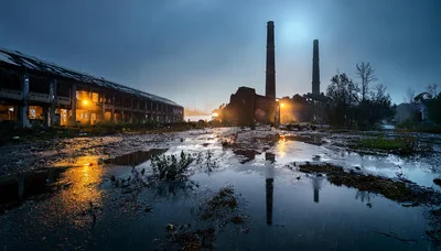 Abandoned Industrial Factory Ruins At Night In Rain