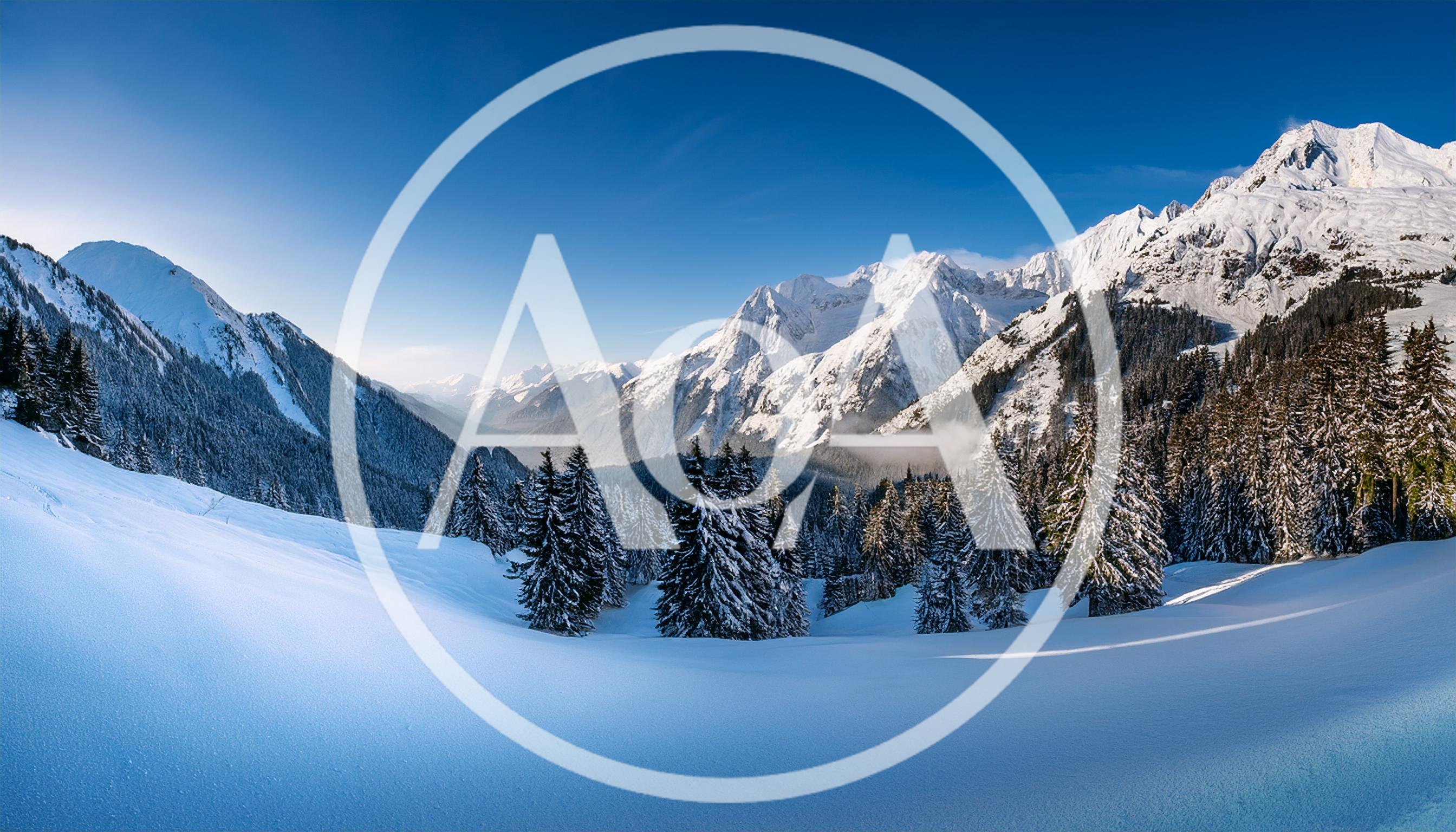 Panoramic View Of Snowy Alpine Mountains In Winter