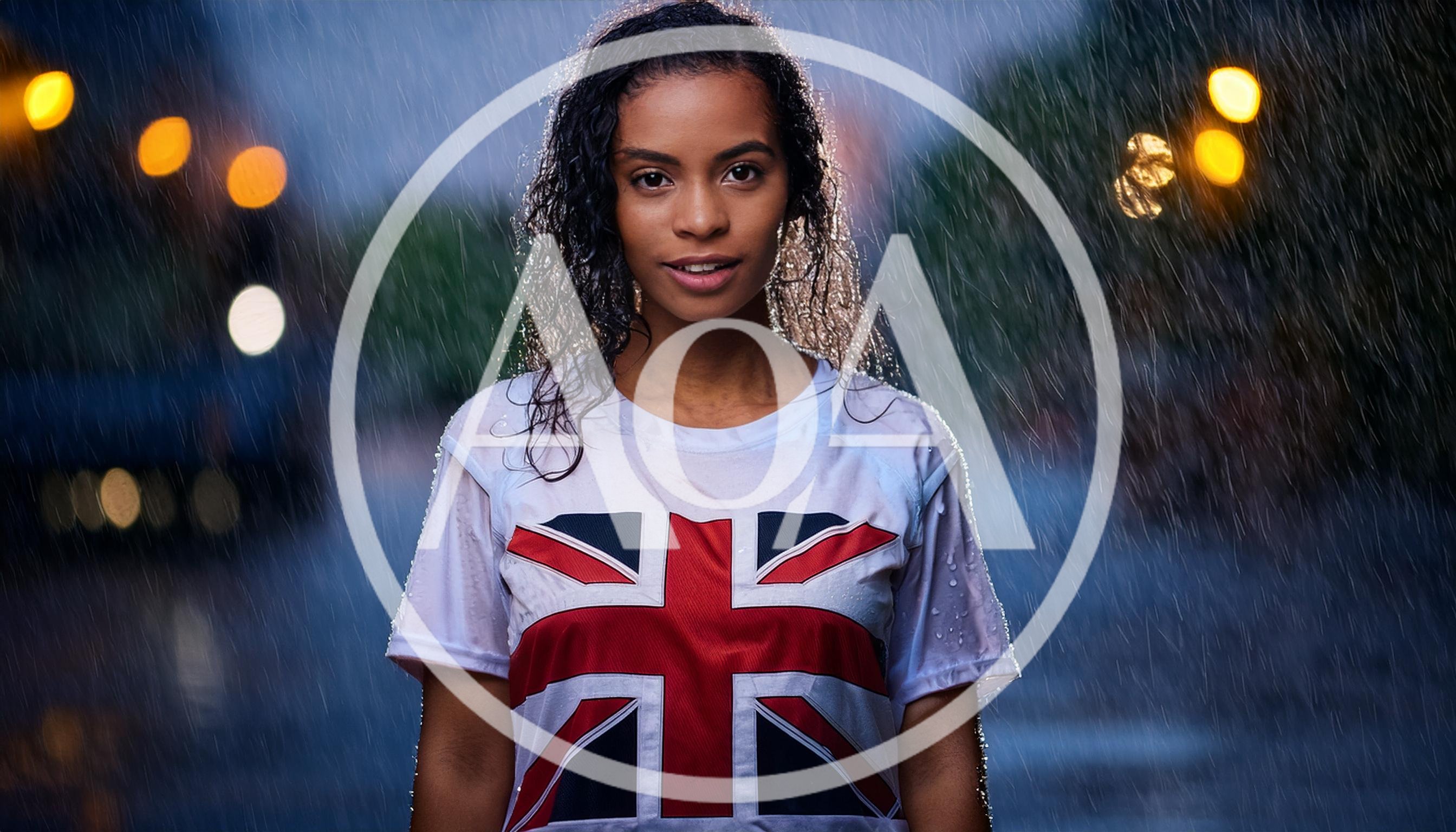 Young Woman Wearing Union Jack Shirt In Rain