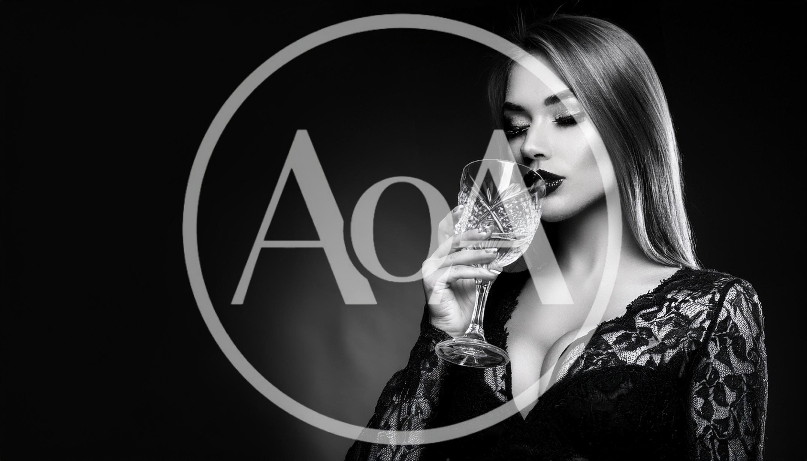 Elegant Woman Drinking From A Crystal Glass