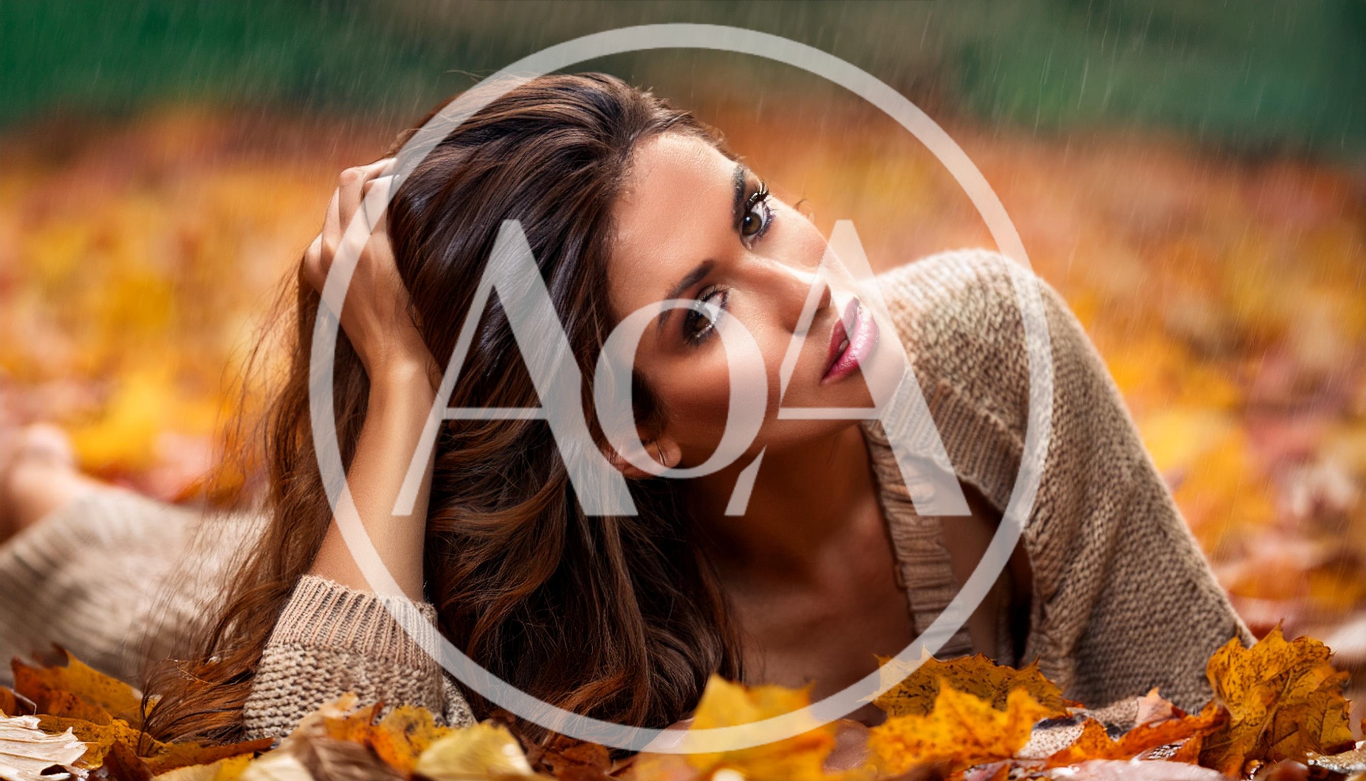 Beautiful Woman Lying In Autumn Leaves During Rain