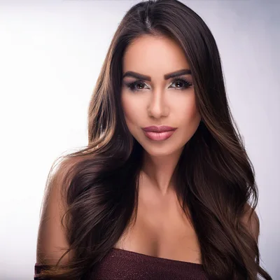 Portrait Of A Beautiful Woman With Long Wavy Hair
