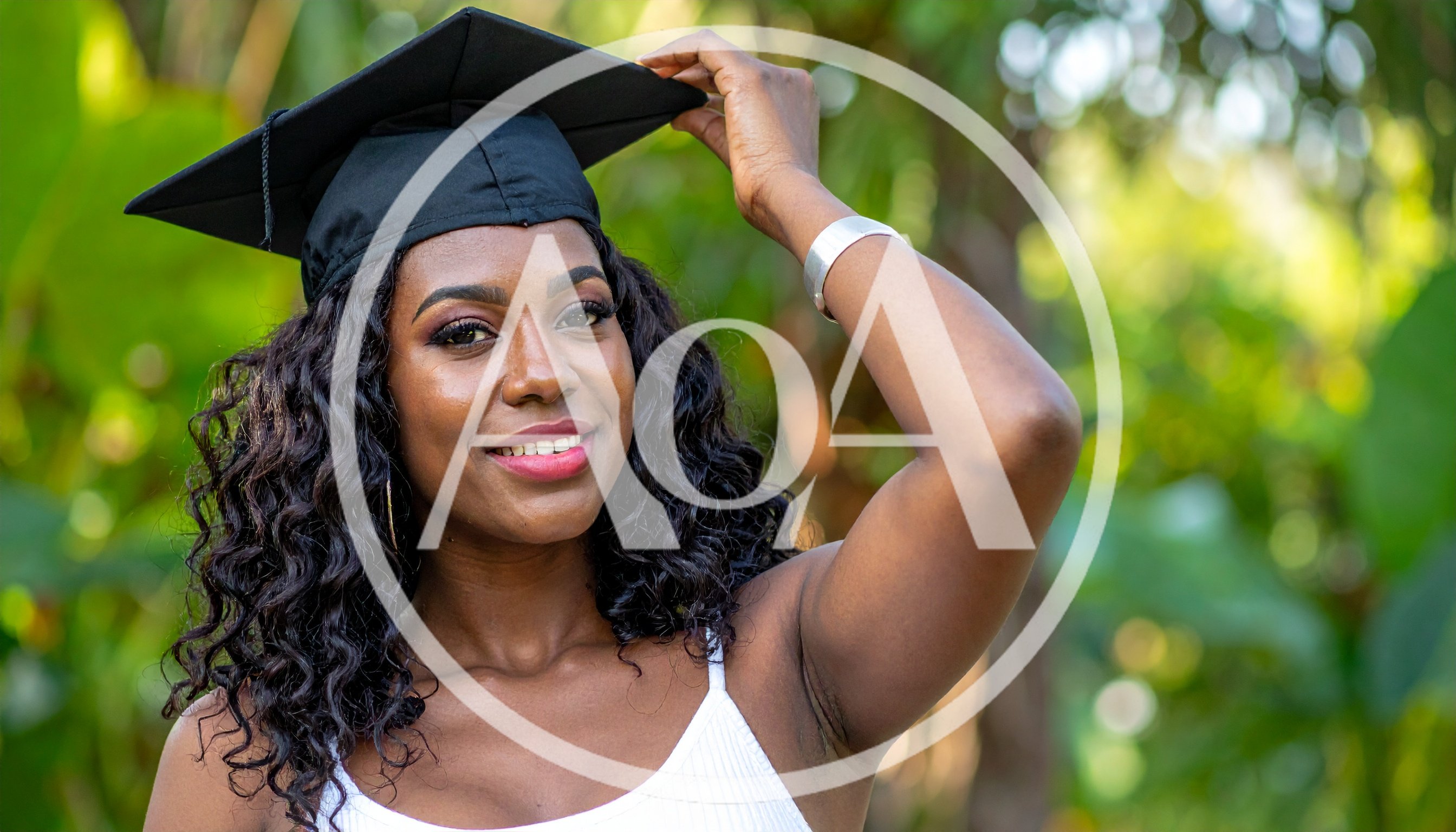 Young Woman Wearing Graduation Cap Outdoors