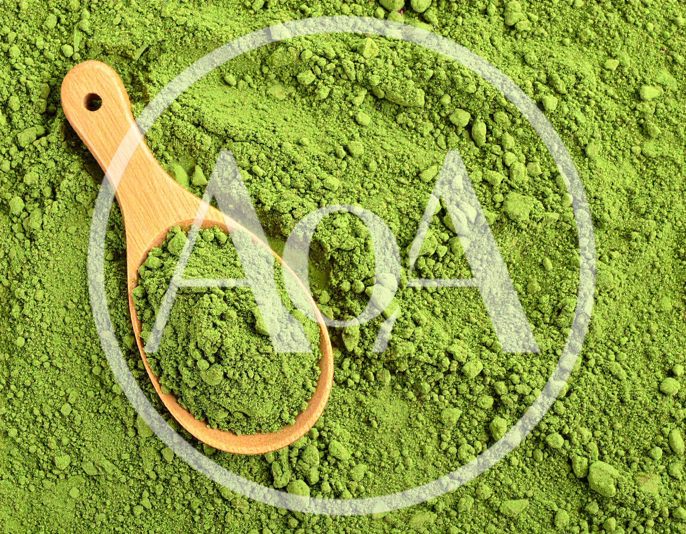 Wooden Spoon Filled With Vibrant Green Matcha Powder