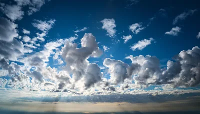 Dramatic Blue Sky With Fluffy White Cumulus Clouds