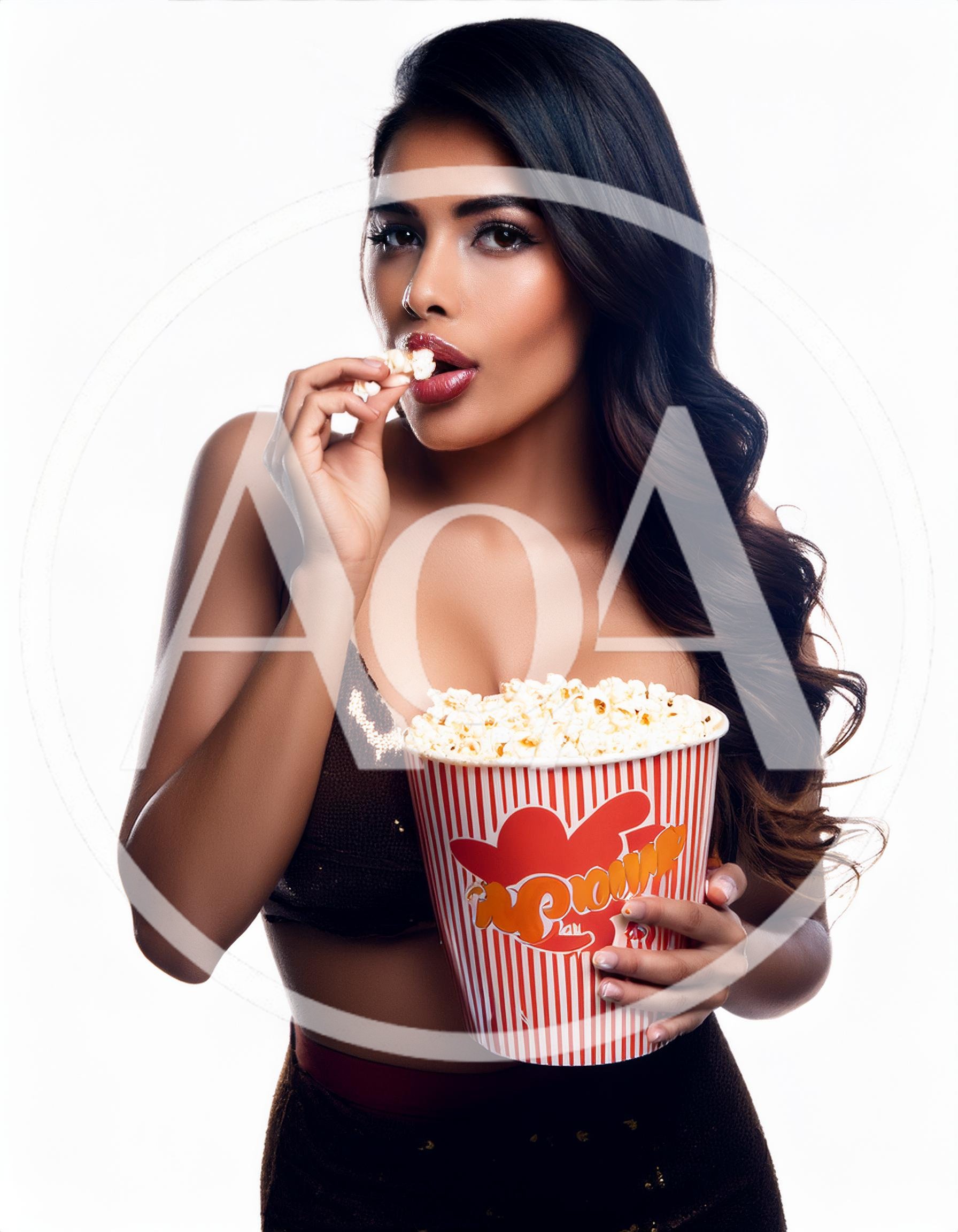 Beautiful Woman Eating Popcorn From A Striped Bucket