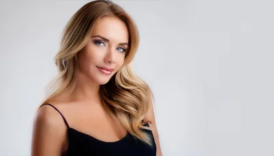 Portrait Of A Beautiful Blonde Woman In Black Top