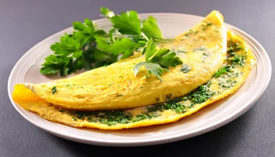 Fresh Herb Omelet Served On A White Plate